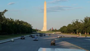 President Donald Trump's motorcade drives on the Lincoln Memorial Reflecting Pool as it undergoes renovations